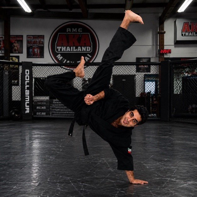 Mah Ghasemi mid-kick during martial arts practice
